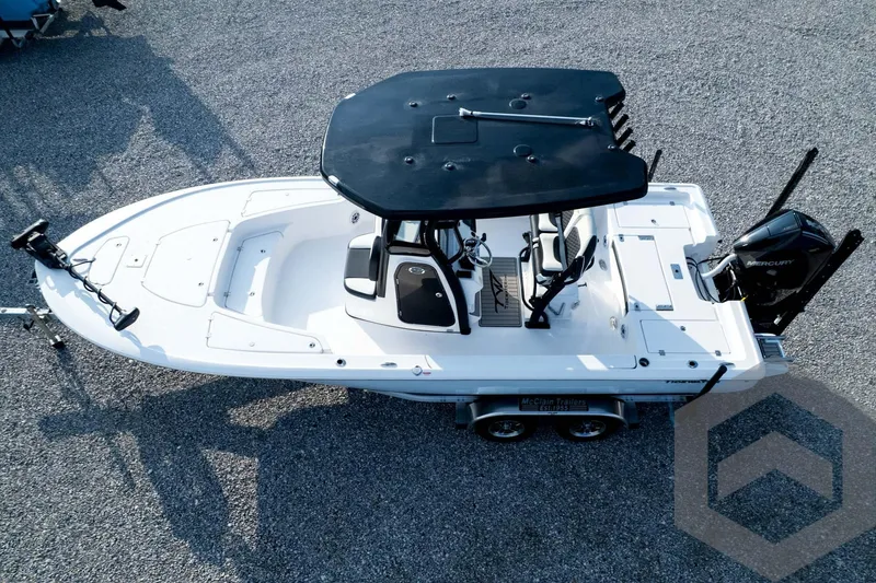 Slide: The Image of 2026 Tidewater 2410 Bay Max boat on trailer, aerial view, black T-top, white hull. - 95