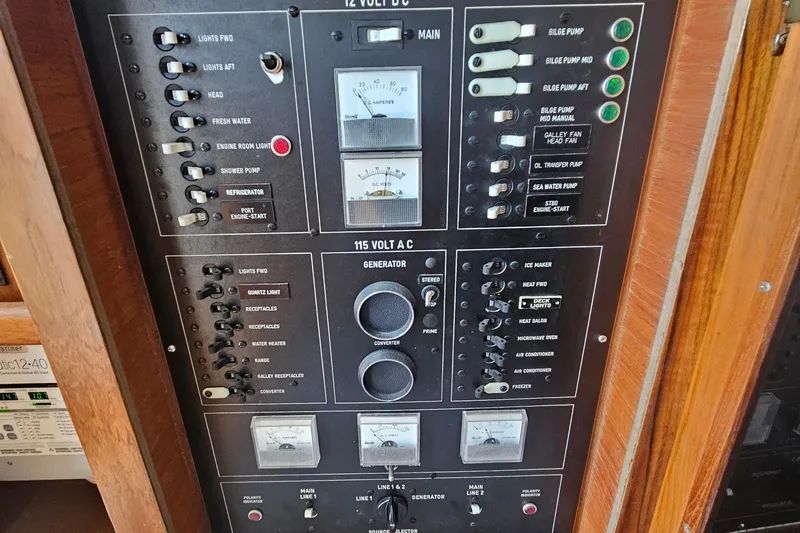 Slide: The Image of Electrical control panel on a 1986 Viking 35 Convertible boat, featuring various switches and gauges. - 10
