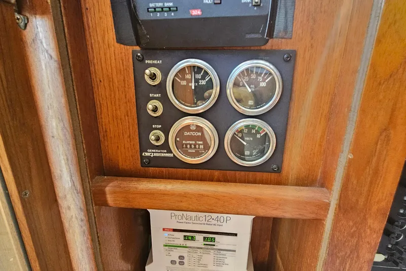 Slide: The Image of Control panel of a 1986 Viking 35 Convertible boat with gauges and ProNautic charger. - 11