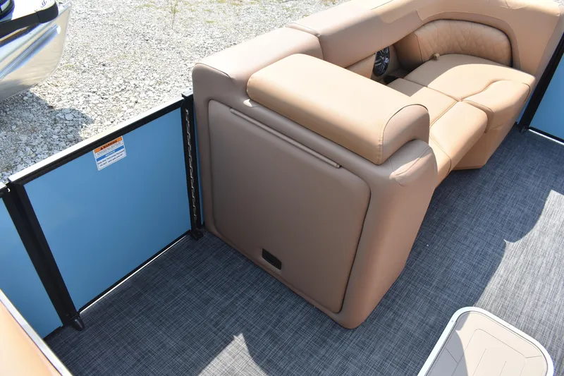 Slide: The Image of 2026 Godfrey SWEETWATER 2286 SFL boat interior with tan seating and blue paneling. - 14