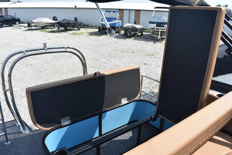 Slide: The Image of 2026 Godfrey SWEETWATER 2286 SFL boat interior storage compartment open, showcasing spacious design. - 15