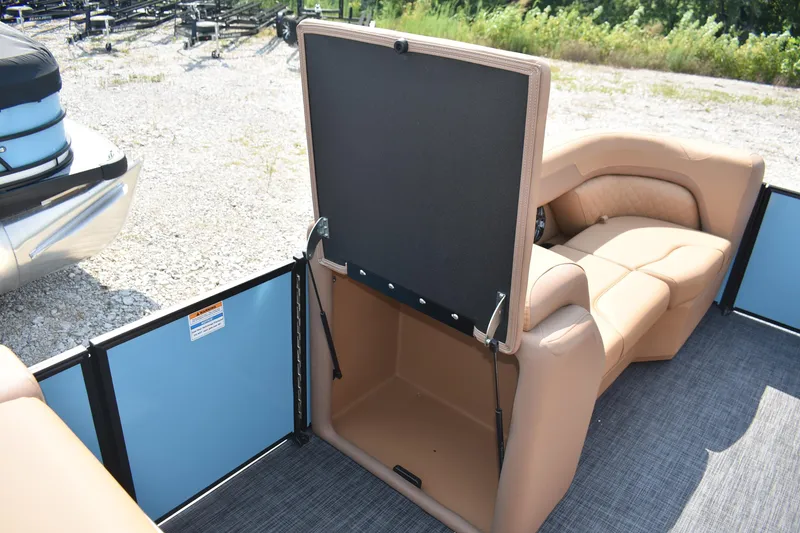 Slide: The Image of 2026 Godfrey SWEETWATER 2286 SFL boat interior with open storage compartment and seating. - 20