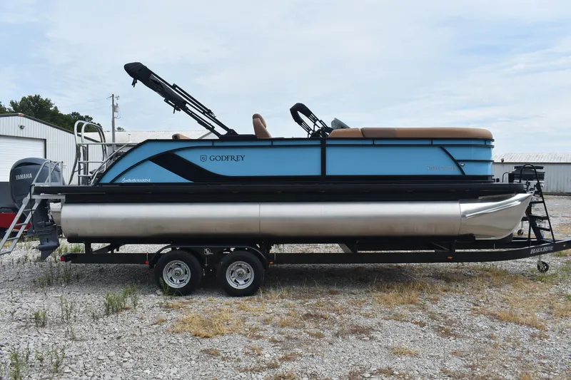 Slide: The Image of 2026 Godfrey Sweetwater 2286 SFL Tritoon on trailer, side view, outdoors. - 3