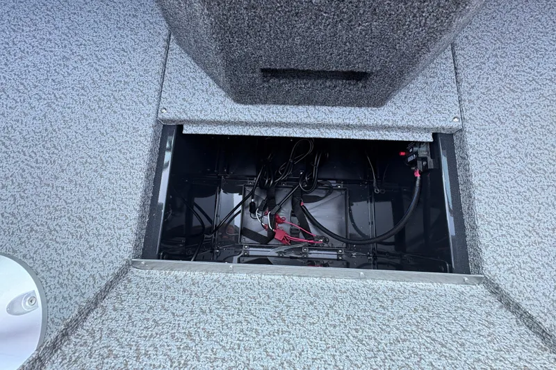 Slide: The Image of 2026 Lund 1875 Pro-V Sport boat interior storage compartment with wiring. - 19