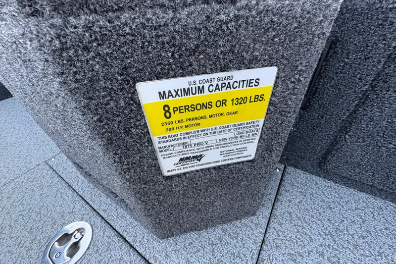 Slide: The Image of 2026 Lund 1875 Pro-V Sport capacity label, 8 persons or 1320 lbs, U.S. Coast Guard compliant. - 20