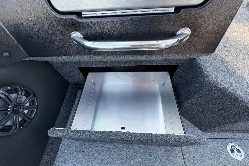 Slide: The Image of Open storage compartment in 2026 Lund 1875 Pro-V Sport boat interior. - 21