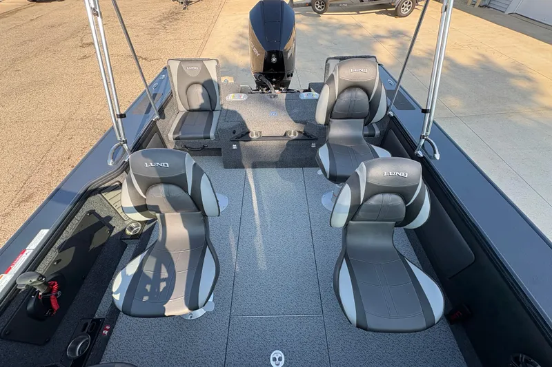 Slide: The Image of 2026 Lund 1875 Pro-V Sport boat interior with four gray seats and modern design. - 26