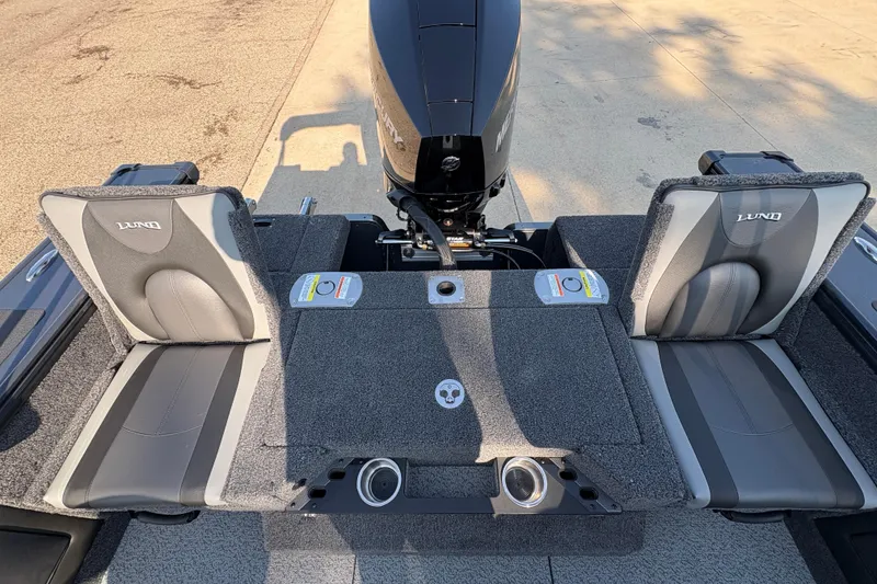 Slide: The Image of 2026 Lund 1875 Pro-V Sport boat interior with dual seats and motor. - 30