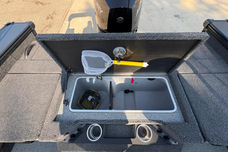 Slide: The Image of 2026 Lund 1875 Pro-V Sport boat livewell with net and storage compartments. - 32