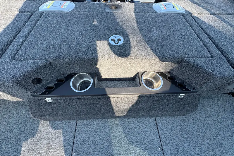 Slide: The Image of 2026 Lund 1875 Pro-V Sport boat interior with cup holders and storage compartments. - 33