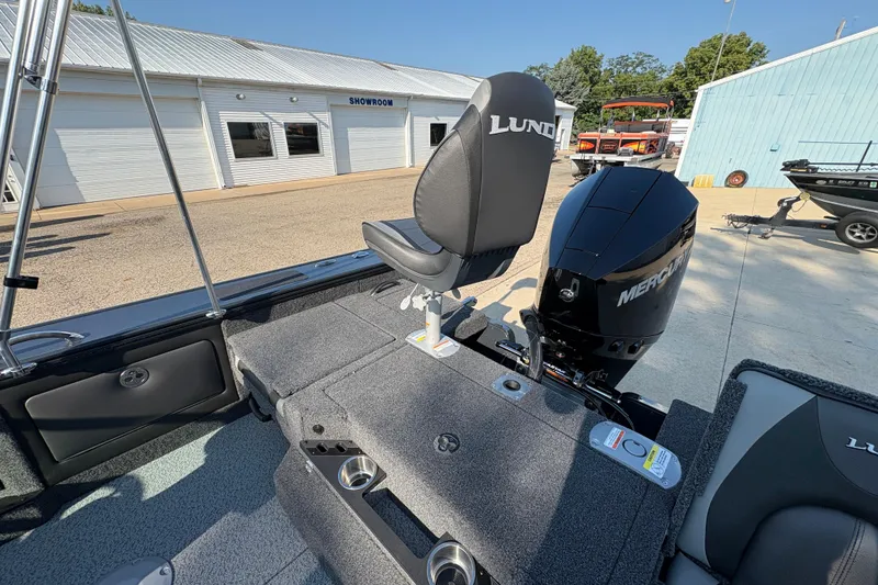 Slide: The Image of 2026 Lund 1875 Pro-V Sport boat with Mercury engine at a showroom. - 36