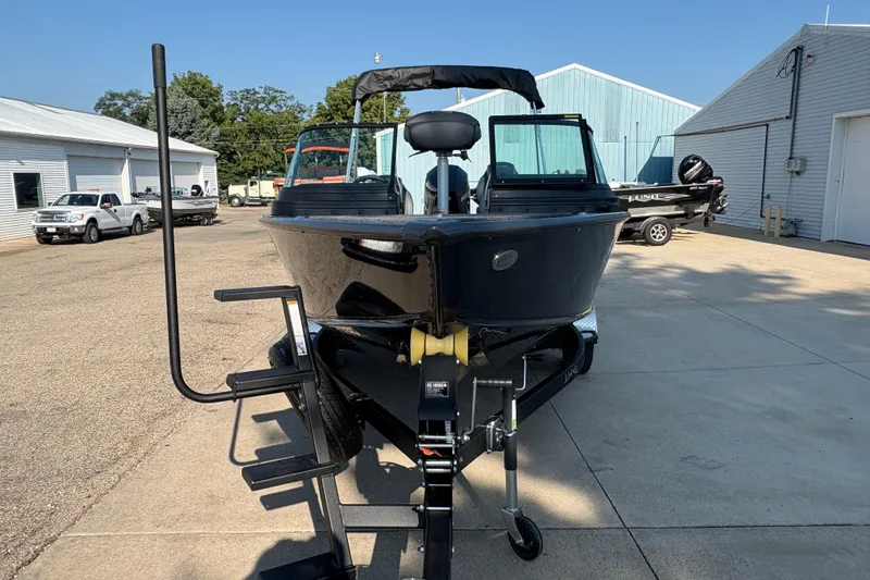 Slide: The Image of 2026 Lund 1875 Pro-V Sport boat on trailer in outdoor setting. - 6