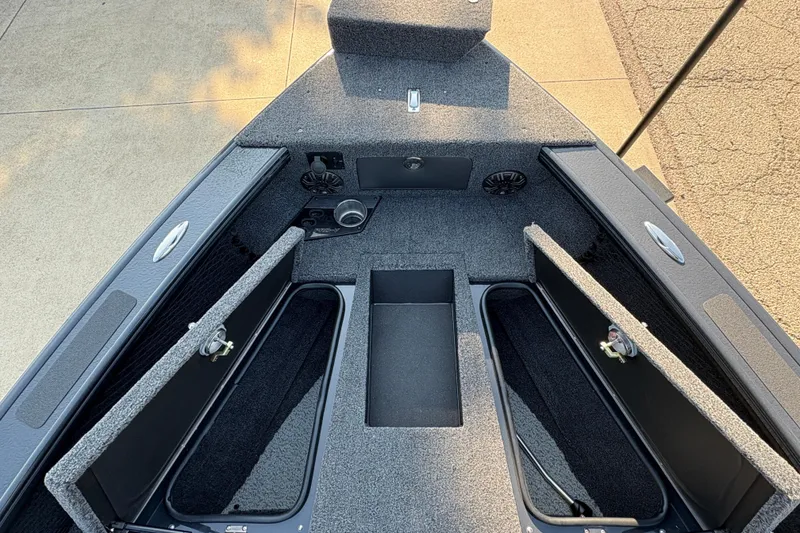 Slide: The Image of 2026 Lund 1875 Pro-V Sport boat interior with open storage compartments. - 8