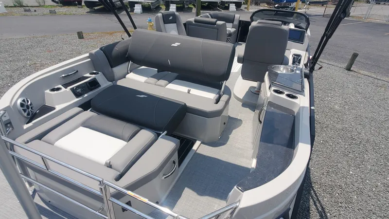 Slide: The Image of 2025 Starcraft MX 23 DL DH boat interior with modern seating and amenities. - 10