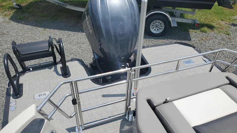 Slide: The Image of 2025 Starcraft MX 23 DL DH boat with Yamaha outboard motor, rear deck view. - 11