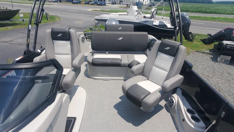 Slide: The Image of 2025 Starcraft MX 23 DL DH boat interior with plush seating and modern design. - 3