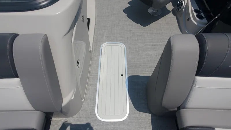 Slide: The Image of Interior of 2025 Starcraft MX 23 DL DH boat with gray seating and flooring. - 4