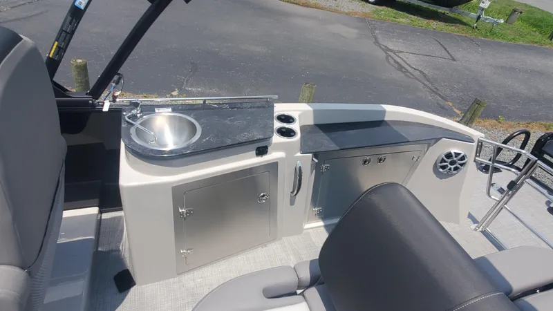 Slide: The Image of 2025 Starcraft MX 23 DL DH boat interior with sink and storage cabinets. - 7