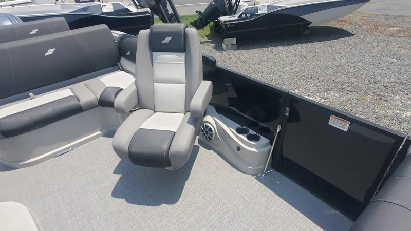 Slide: The Image of 2025 Starcraft MX 23 DL DH boat interior with seating and cup holders. - 8