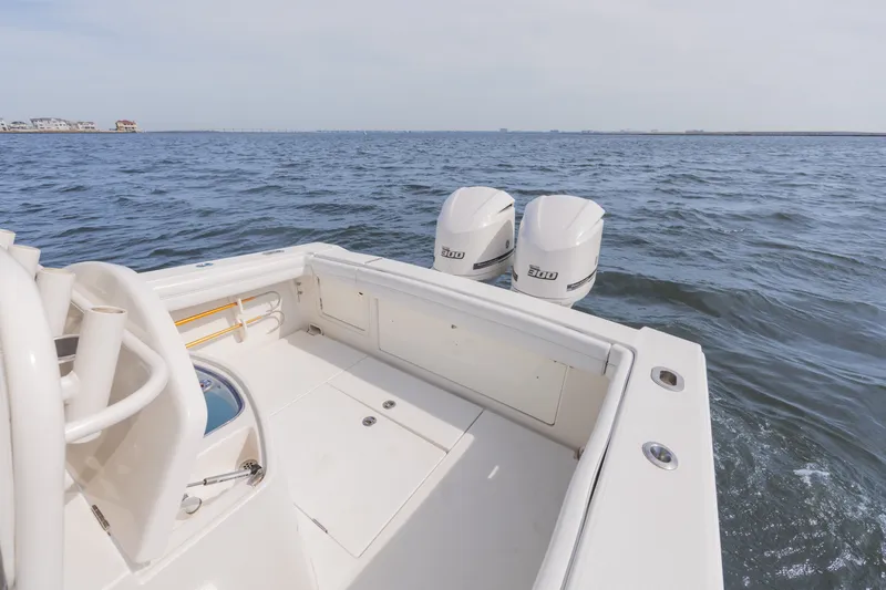 Slide: The Image of 2014 Jupiter 30 boat on open sea with dual engines. - 13