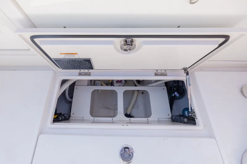 Slide: The Image of Open storage compartment on a 2014 Jupiter 30 boat. - 15