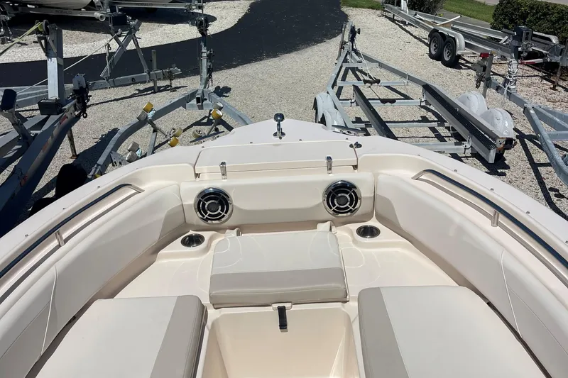 Slide: The Image of 2014 Grady-White Freedom 225 boat interior with seating and cup holders. - 10