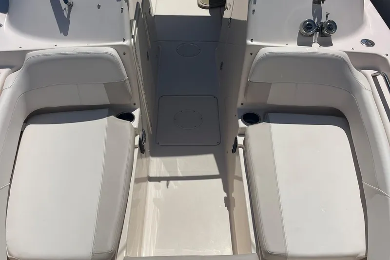 Slide: The Image of 2014 Grady-White Freedom 225 boat interior with dual seating and cup holders. - 11