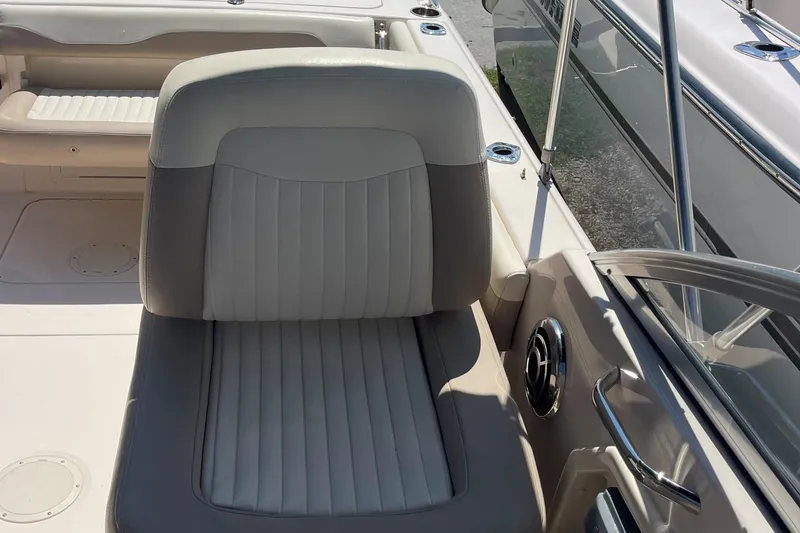 Slide: The Image of 2014 Grady-White Freedom 225 boat interior with cushioned seating and stainless steel accents. - 12