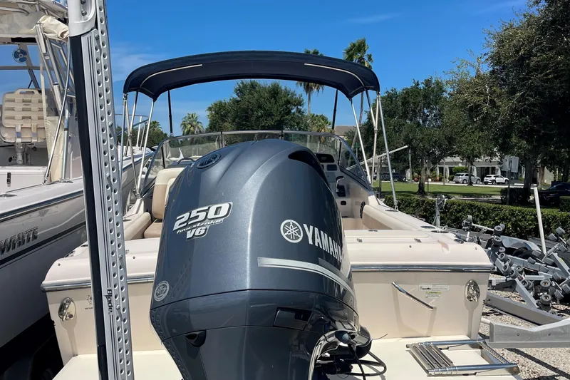 Slide: The Image of 2014 Grady-White Freedom 225 boat with Yamaha 250 V6 engine, docked outdoors. - 13