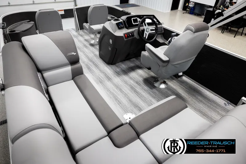 Slide: The Image of 2026 Bennington 168 SFSE boat interior with modern seating and steering console. - 11