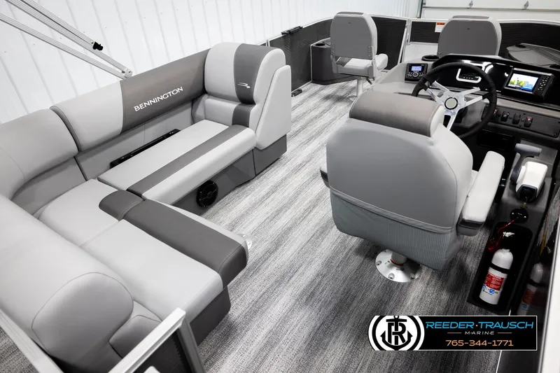 Slide: The Image of 2026 Bennington 168 SFSE pontoon boat interior with gray seating and modern dashboard. - 12