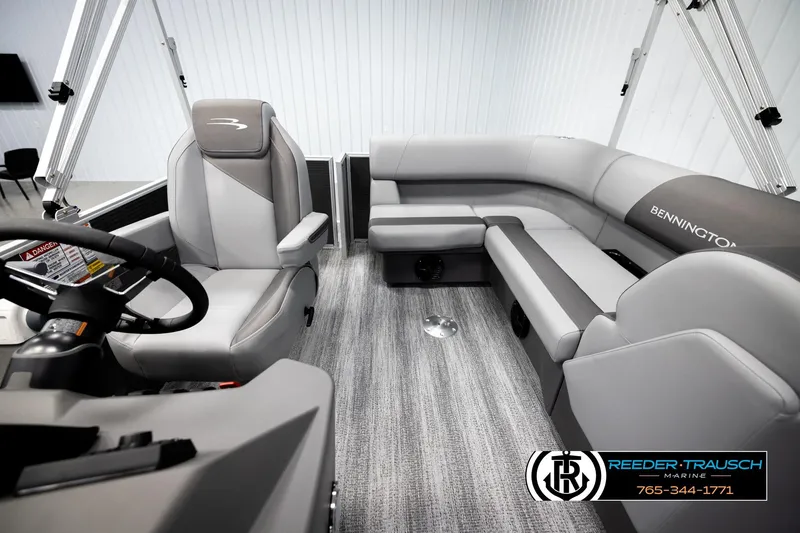 Slide: The Image of 2026 Bennington 168 SFSE boat interior with gray seating and steering console. - 14