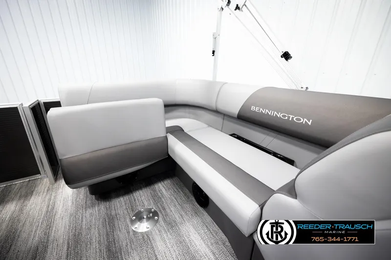 Slide: The Image of 2026 Bennington 168 SFSE boat interior with gray seating and logo. - 22