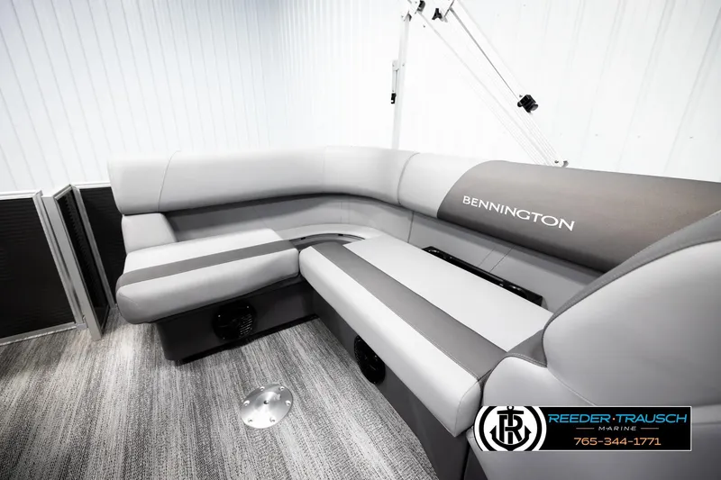 Slide: The Image of 2026 Bennington 168 SFSE boat interior with gray seating and logo. - 23
