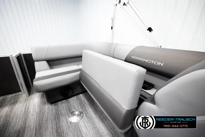 Slide: The Image of 2026 Bennington 168 SFSE boat interior with gray seating and logo, Reeder-Trausch Marine branding. - 24