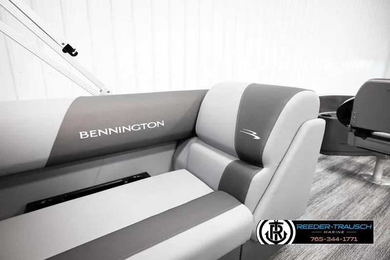 Slide: The Image of 2026 Bennington 168 SFSE boat interior with gray seating and logo detail. - 26