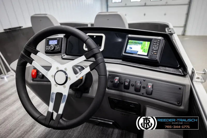 Slide: The Image of 2026 Bennington 168 SFSE boat dashboard with steering wheel and navigation system. - 28