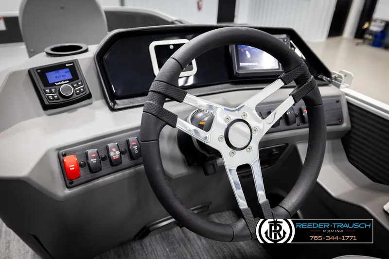 Slide: The Image of Steering console of 2026 Bennington 168 SFSE boat with modern controls and display. - 29