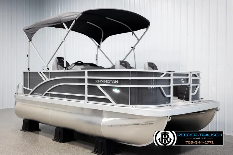 Slide: The Image of 2026 Bennington 168 SFSE pontoon boat with canopy in showroom display. - 3