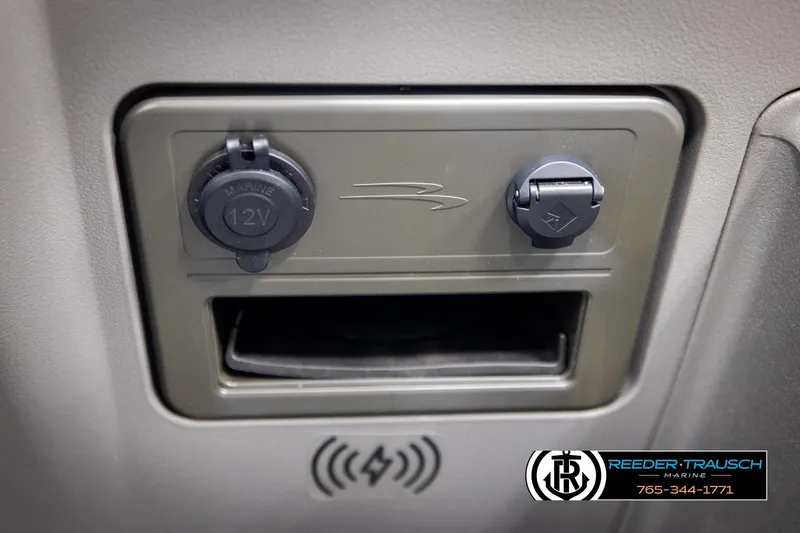 Slide: The Image of 2026 Bennington 168 SFSE dashboard with 12V marine outlet and USB port. - 36