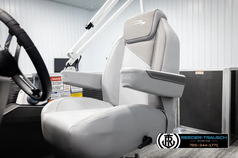 Slide: The Image of 2026 Bennington 168 SFSE boat interior with steering wheel and comfortable captain's chair. - 38