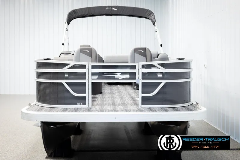 Slide: The Image of 2026 Bennington 168 SFSE pontoon boat in showroom, featuring sleek design and modern amenities. - 8