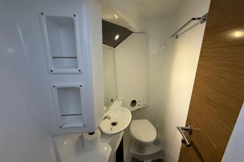 Slide: The Image of Bathroom interior of 2015 Fountaine Pajot Summerland 40 LC yacht, featuring modern fixtures. - 102