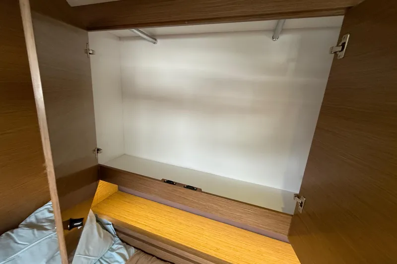 Slide: The Image of Empty wooden closet inside 2015 Fountaine Pajot Summerland 40 LC yacht. - 108