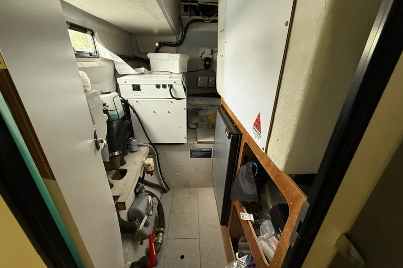 Slide: The Image of Engine room of 2015 Fountaine Pajot Summerland 40 LC with equipment and storage. - 109