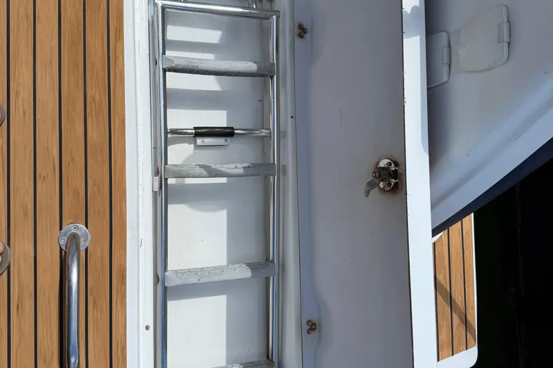 Slide: The Image of swim ladder - 2015 Fountaine Pajot Summerland 40 LC boat ladder and teak deck detail. - 117
