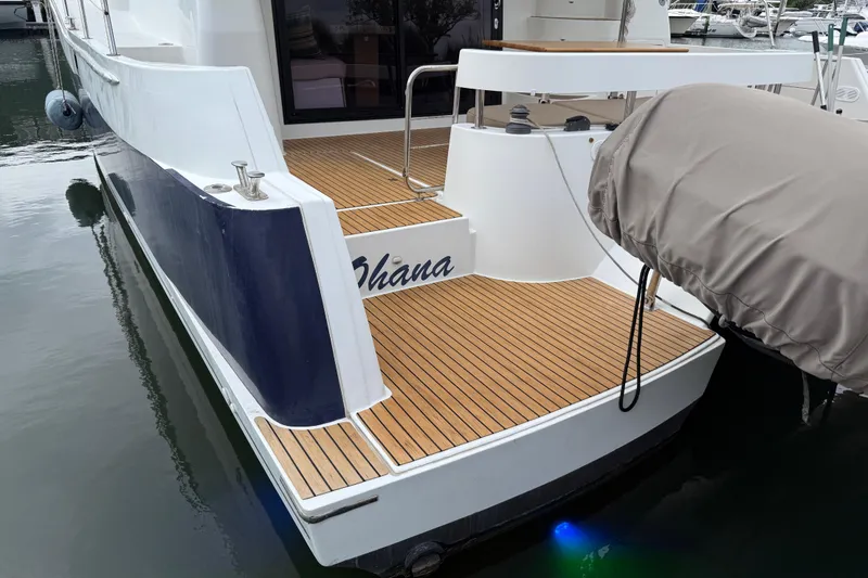 Slide: The Image of 2015 Fountaine Pajot Summerland 40 LC yacht with teak deck at marina. - 16