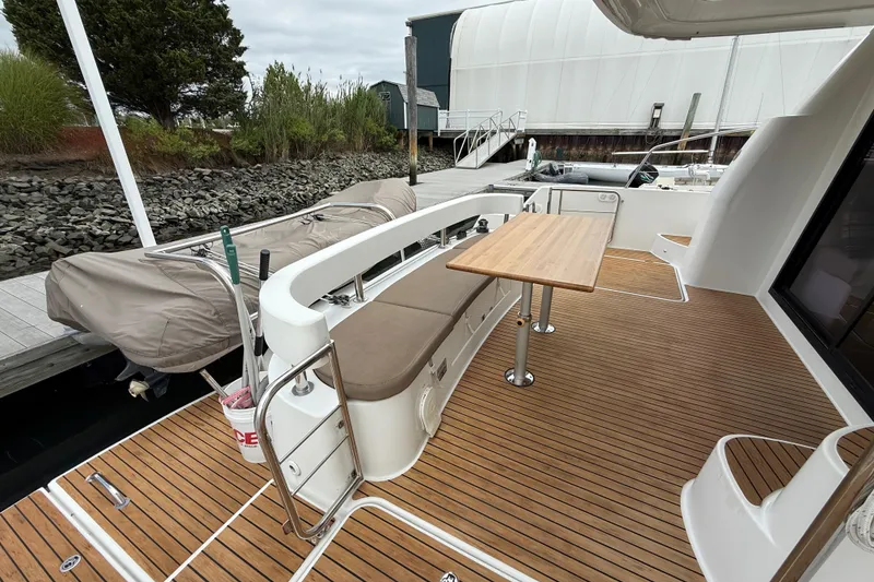 Slide: The Image of 2015 Fountaine Pajot Summerland 40 LC yacht deck with seating and table. - 19