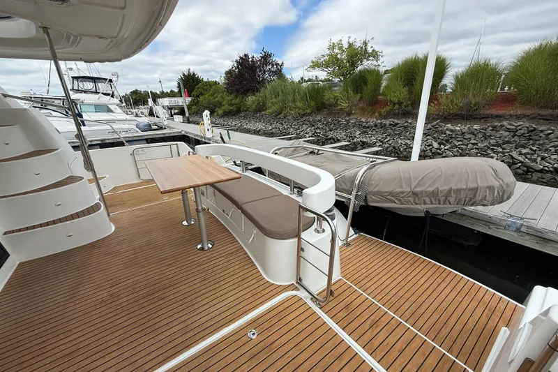 Slide: The Image of 2015 Fountaine Pajot Summerland 40 LC yacht deck with seating and table. - 20