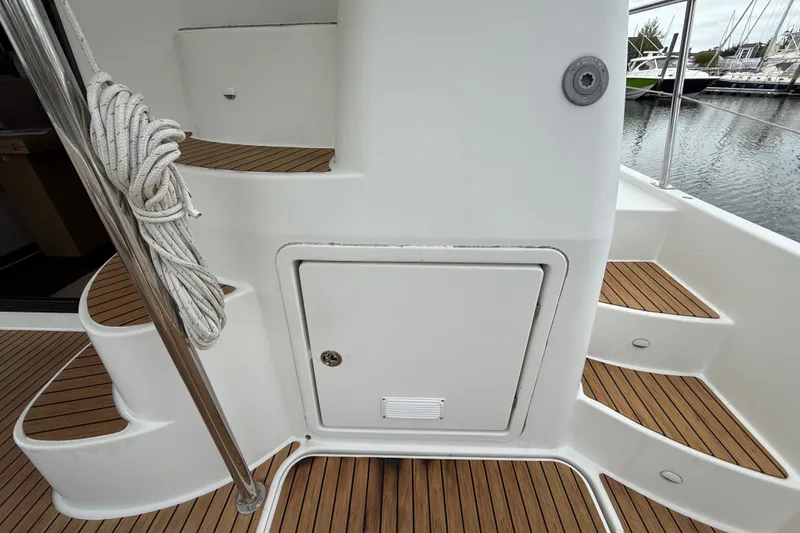 Slide: The Image of Staircase and storage on 2015 Fountaine Pajot Summerland 40 LC yacht deck. - 22
